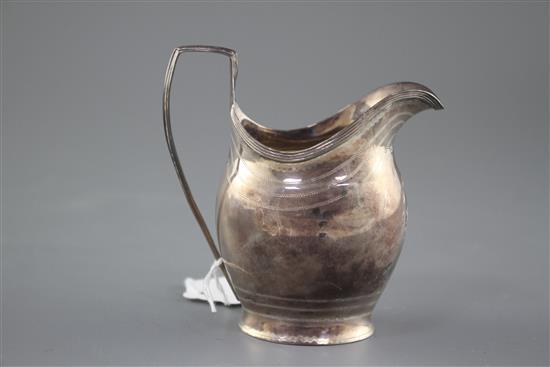 A George III engraved silver helmet shaped cream jug by George Burrows, London, 1799, height 11cm, 3.5oz.